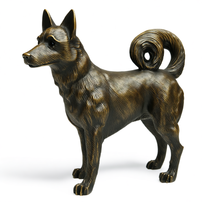 A bronze sculpture of a Shiba Inu dog, standing with its tail curled. The sculpture is detailed and shows the texture of the dog's fur.